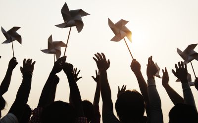 People holding pinwheels